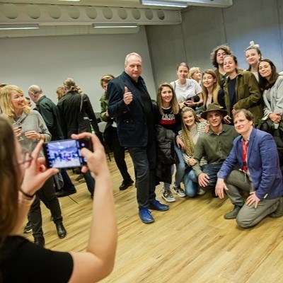 A group of people are posing for a photo together with masterclasses lecturers Rimantas Plungė and Titas Petrikis
