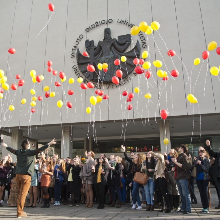 A group of people with balloons