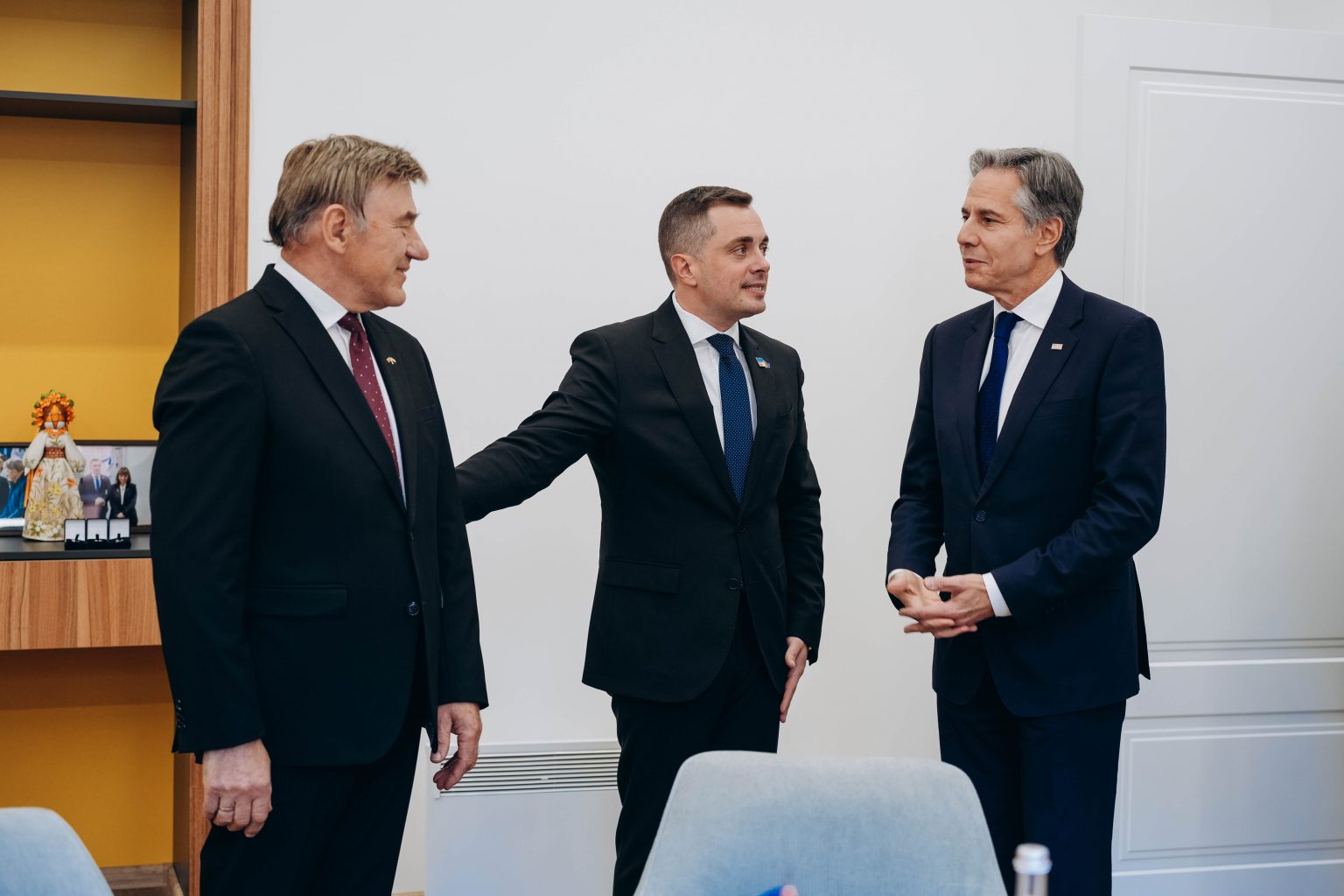 Meeting of three men in suits