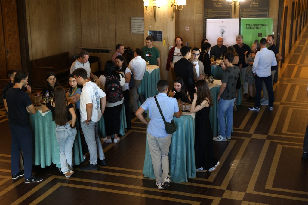 People standing and talking to each other