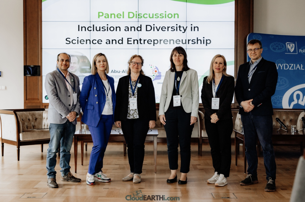 Six people in business attire posing for a photo, text in the background: Panel Discussion Inclusion and Deiversity in Science and Entrepreneurship