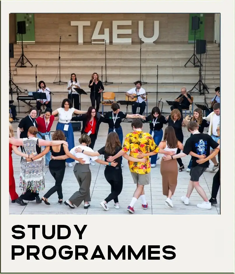 A group of people dance in a circle outdoors while musicians perform on a stage behind them. Large letters spelling T4EU are displayed above the stage. The text STUDY PROGRAMMES appears at the bottom.